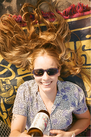 girl lying on the blanket holding shroom relax
